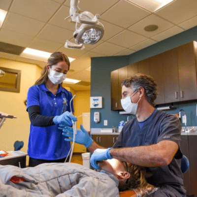 Dr. Holbert working on a patient, representing holbert family orthodontics