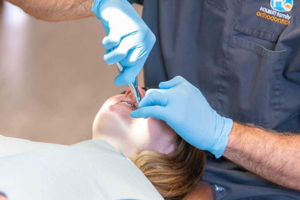 Doctor working on patient with braces